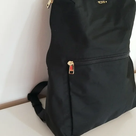 NWT Tumi Just in Case Backpack in Black and Gold